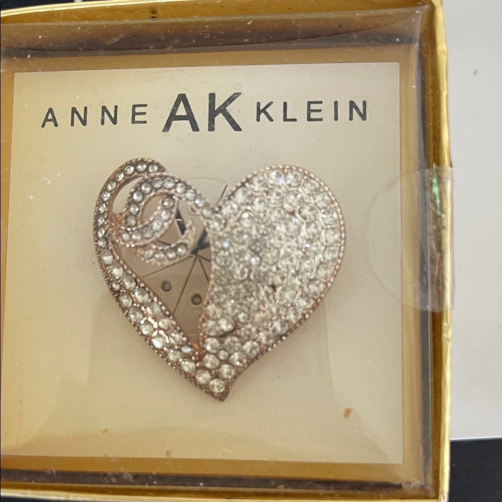 Anne Klein Crystal Embellished Heart Brooch on gold background